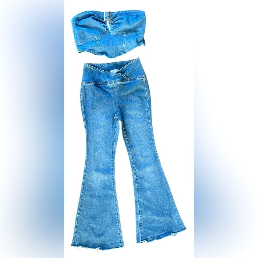 Flare denim jean with v shaped top. Silver buckle on denim top. Small.​​…​